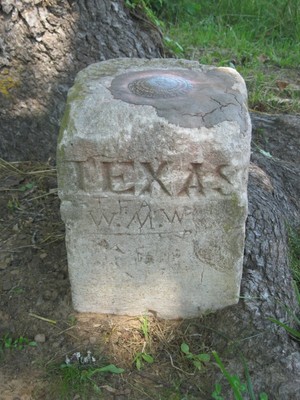The Texas side of the U.S. Geodetic Survey Marker DM1223 identifying the meeting of Arkansas, Louisiana and Texas