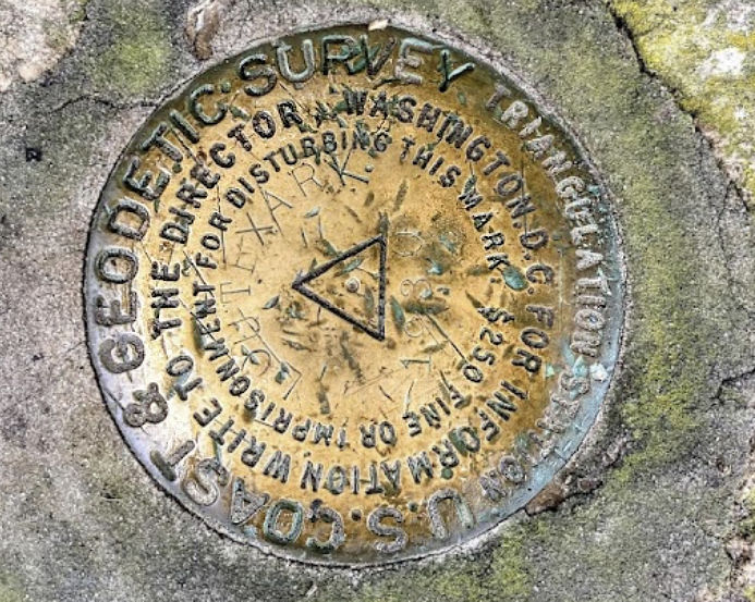 The U.S. Geodetic Survery Marker identifying the meeting of Arkansas, Louisiana and Texas