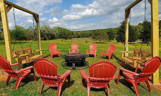 Outdoor seating area and firepit, at the Kaleidoscope Ranch in Big Sandy, Texas